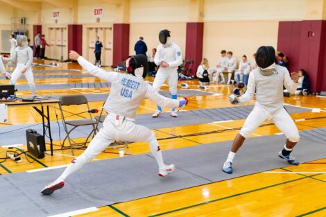 Two fencers.
