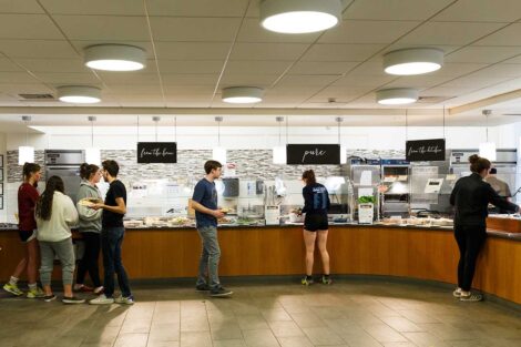 Students get food on a buffet.